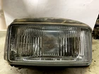 1988 Suzuki LT230S Headlight Assembly 35100-22A00 Used. Price: $64.95.