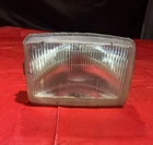 1987 Suzuki Quadrunner Headlight Assembly 35100-18A21 Used. Price: $99.95.