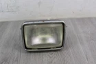 1986 Suzuki LT-F230 Headlight With Housing 35100-18A11 Used. Price: $35.00.