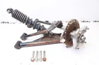 1992 Kawasaki Bayou KLF300B 2WD Front Left Arm Knuckle Hub Shock Assembly Used. Price: $144.00.
